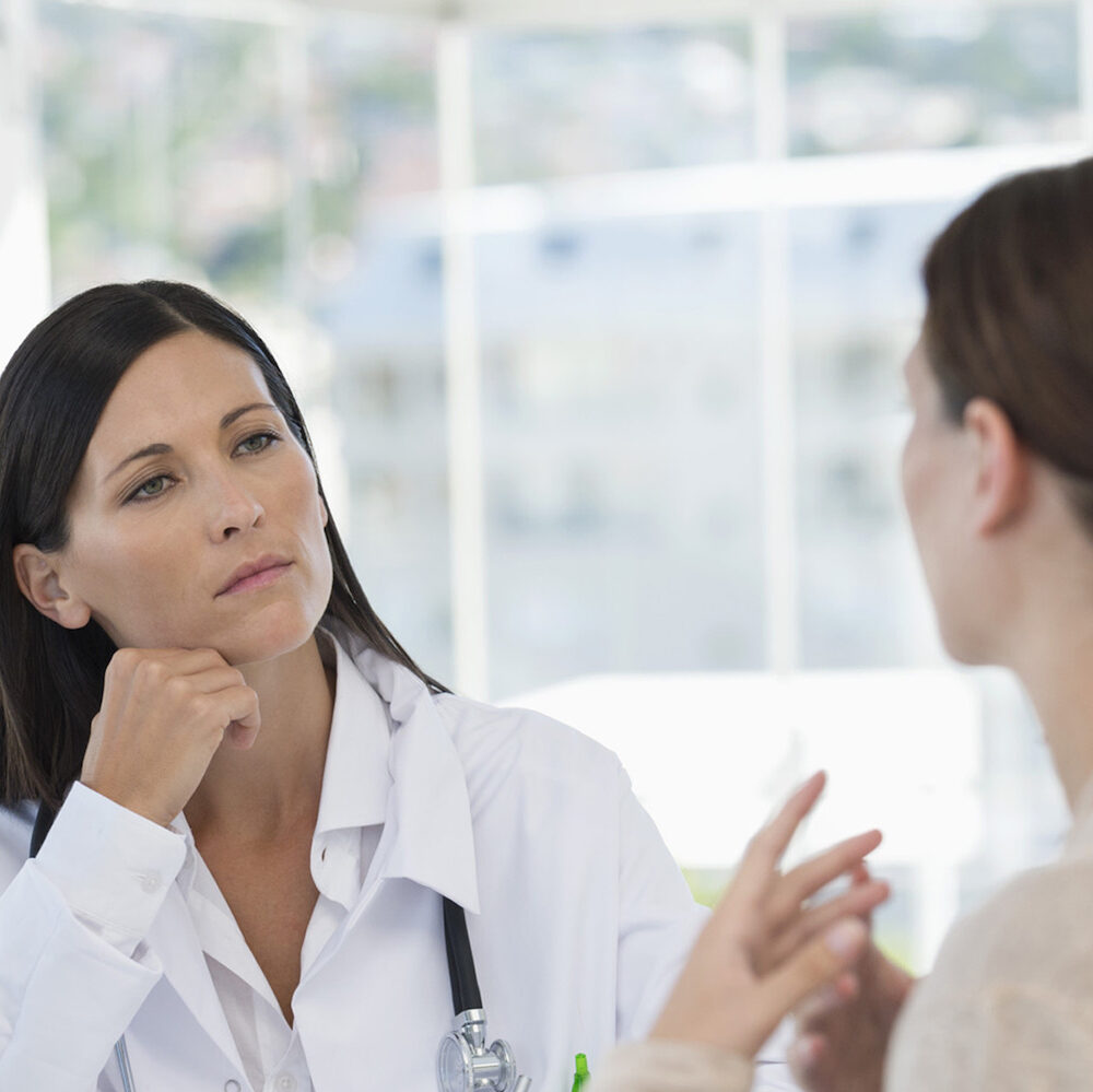 Female doctor discussing with a patient